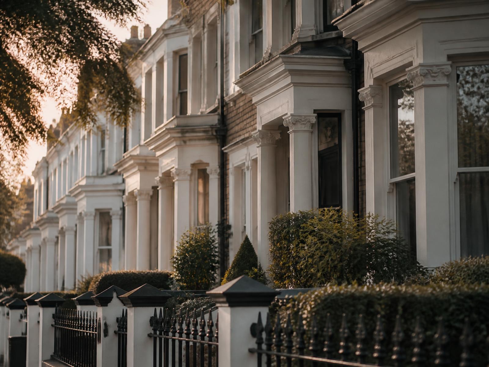 A row of period British terraced houses at golden hour